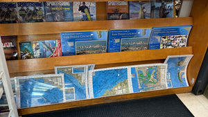 Our fishing maps in the rack for sale at your local tackle shop